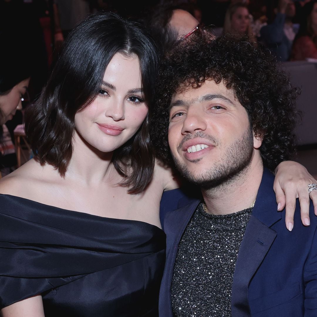 Selena Gomez shows off her engagement ring as she cuddles up to Benny Blanco