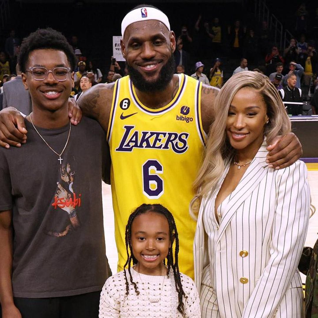 Lebron James celebrates with his wife and kids as he breaks NBA record