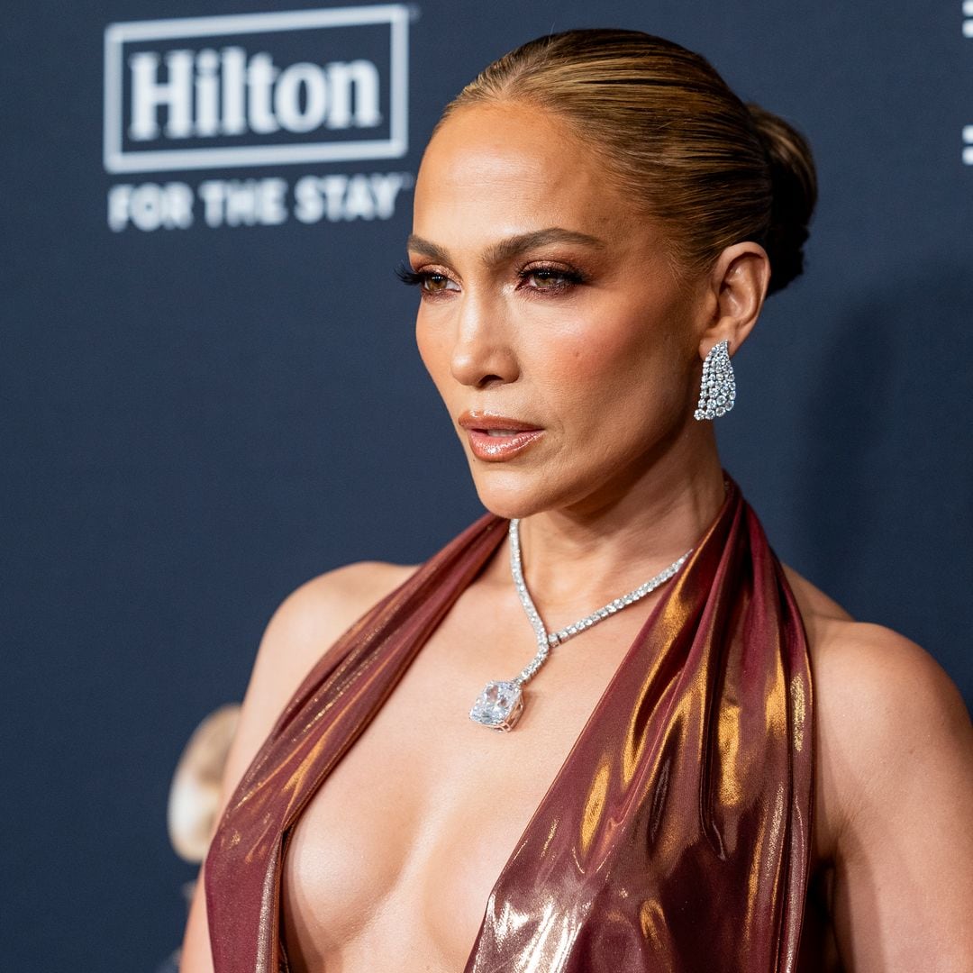 Jennifer Lopez stuns in plunging gown during pre-Grammys party appearance