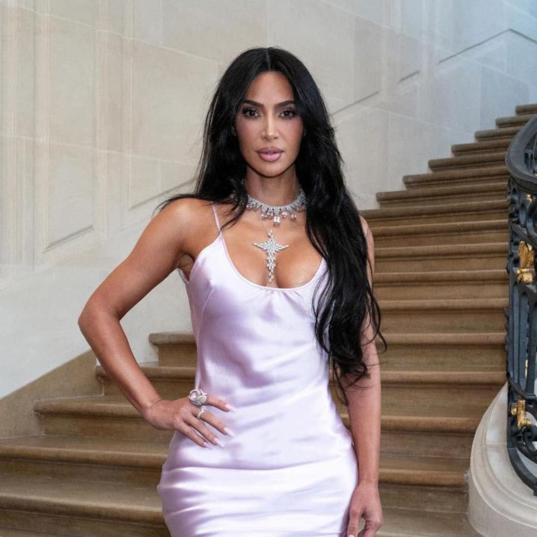 Kim Kardashian appears to be mortified after holding Victoria Beckham’s Paris fashion show