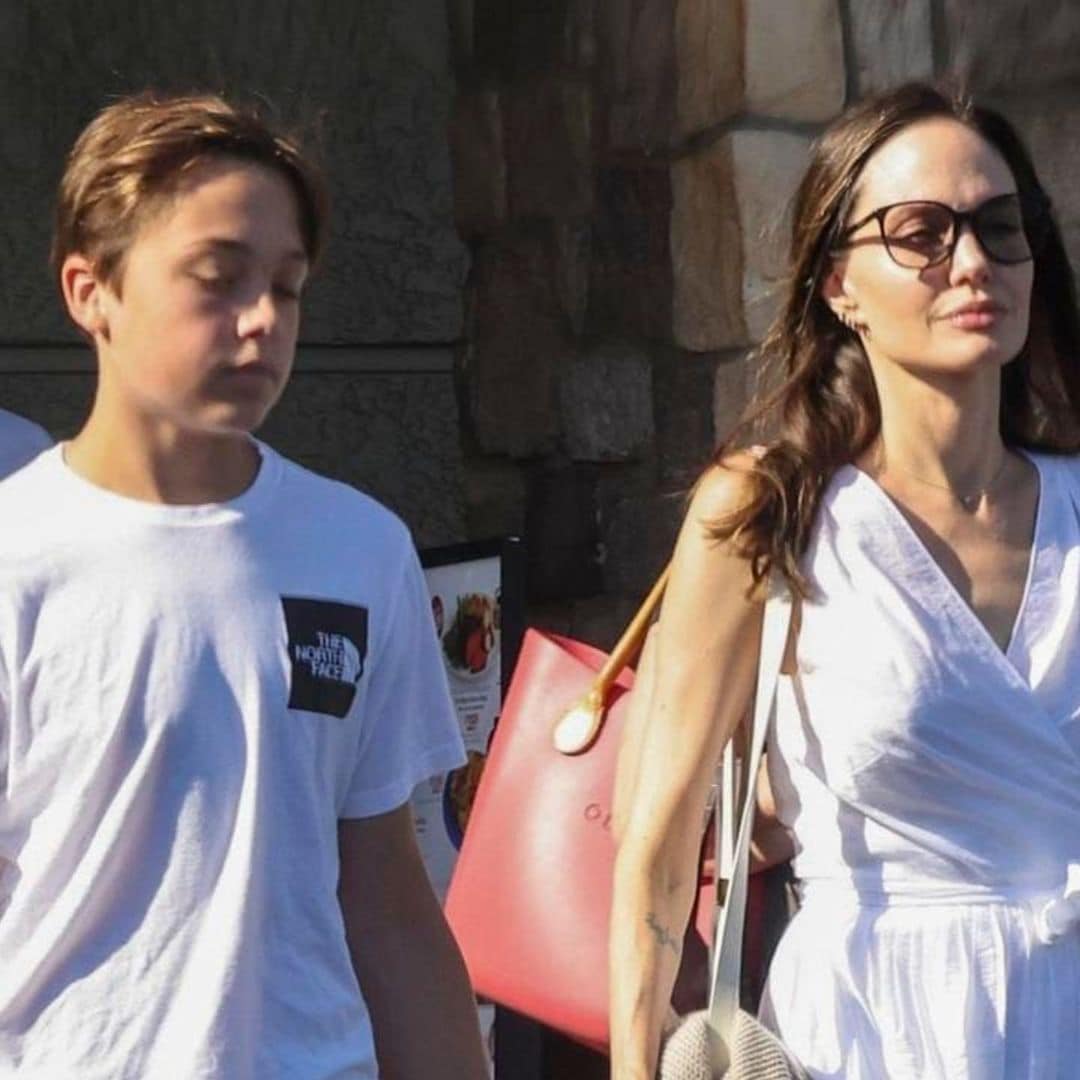 Angelina Jolie wears all white as she goes shopping with her son Knox in Los Angeles