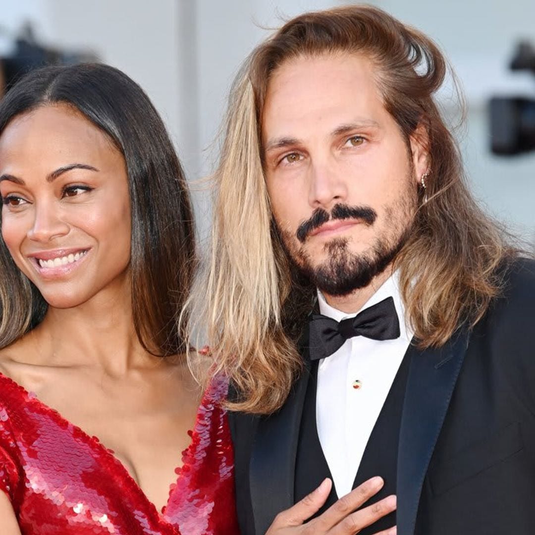 Zoe Saldana kisses her husband on the Venice Film Festival red carpet