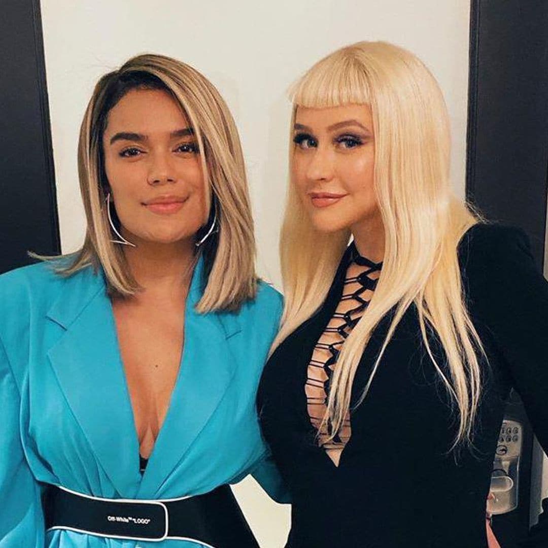 Karol G hangs out with Christina Aguilera at ‘The Addams Family’ premiere