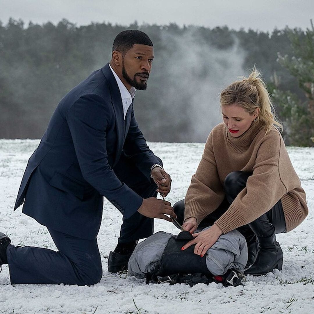 Cameron Diaz and Jamie Foxx laugh in a behind-the-scenes look at 'Back in Action'