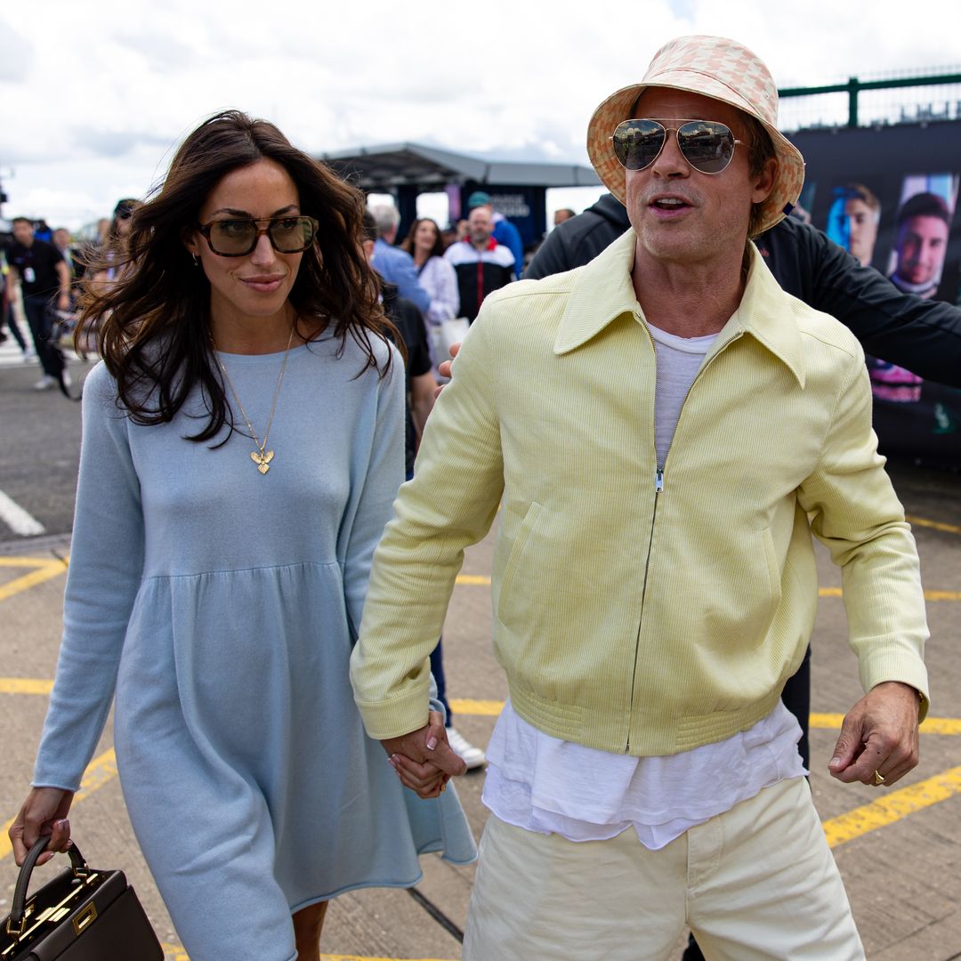 Brad Pitt and Ines de Ramon display their love at the British Grand Prix