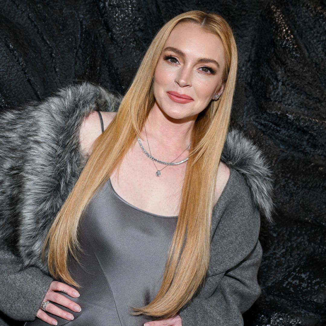 Lindsay Lohan looks stunning in satin slip dress and diamond jewelry at NYFW