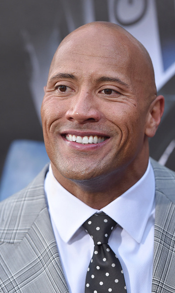 Dwayne 'The Rock' Johnson helps a 2-year-old pull a plane: see the video