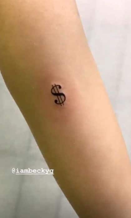 Dollar sign tattoo on Becky Gs left inner forearm