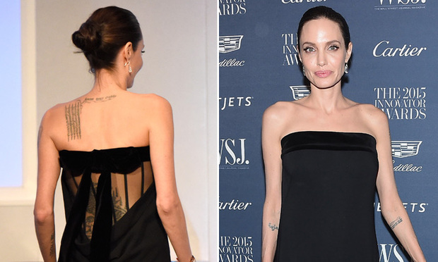 Angelina Jolie shows off tattoos in black strapless sheer dress